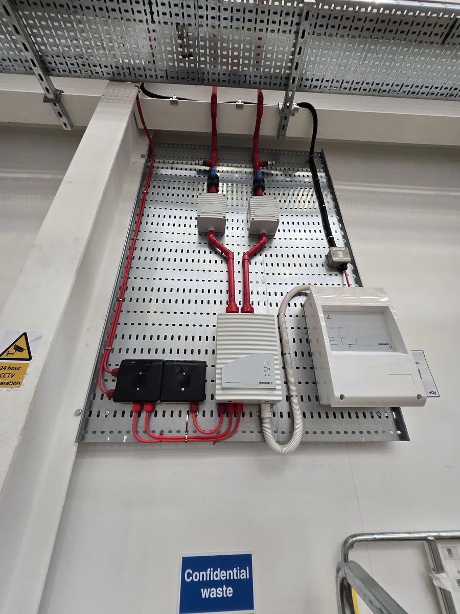 Aspirating smoke detection pipework and Wagner Titanus detection units installed on a cable tray